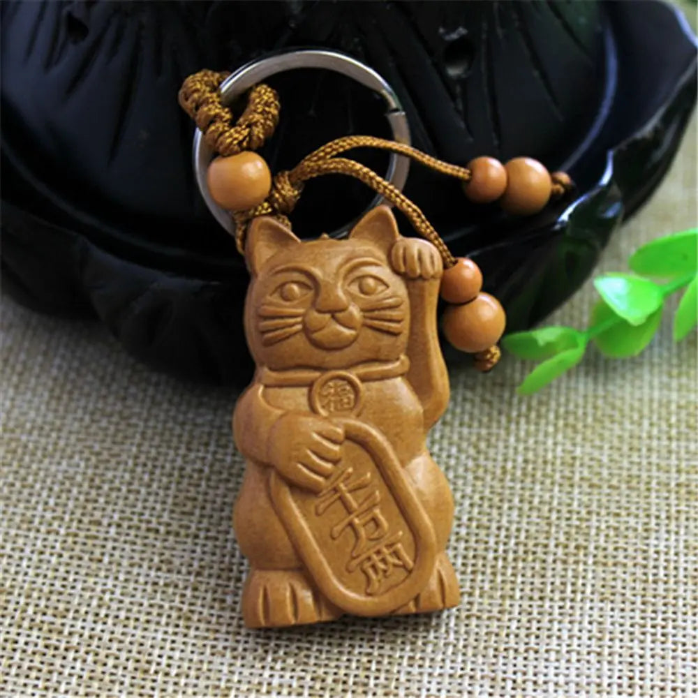 Porte-clef Maneki Neko en bois (foncé)